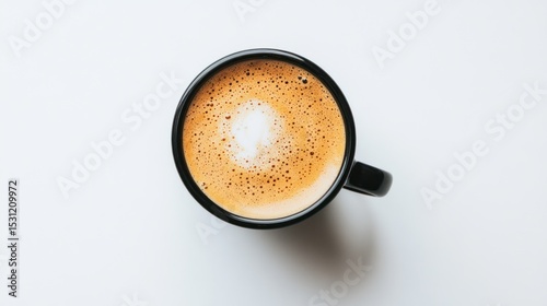 Overhead shot of a black coffee cup with latte art