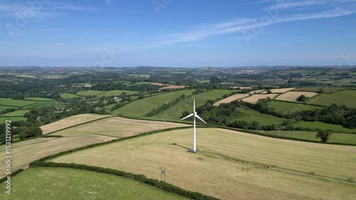 Rattery, near Buckfastleigh, South Devon, England: DRONE VIEWS: A wind turbine surrounded by farm fields. Wind turbines are part of the government renewables strategy for achieving net zero (Clip 2).