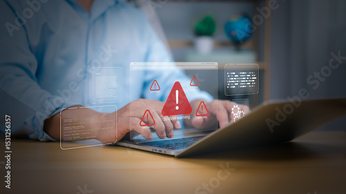Cybersecurity, virus protection, Hand on laptop with holographic System warning and red alert icons. Symbolizes cyber threats, data security breaches, and IT system errors. digital risk management now