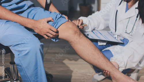 Photography Physical therapist teaching a patient how to do exercises for his knee pain