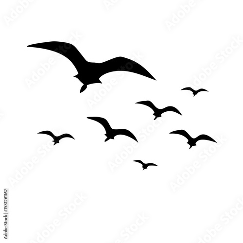 Silhouette of a flock of seagulls flying against a plain background.



