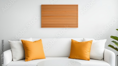 Modern living room design with white sofa and orange accent pillows and wooden wall art