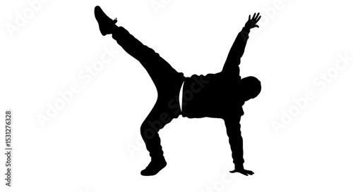 Silhouette of a dancer performing a handstand on one leg  