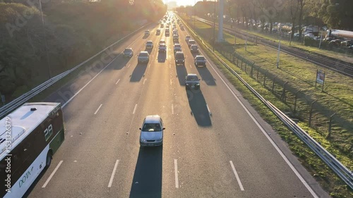 heavy traffic against evening sun on highway in Buenos Aires, Argentina