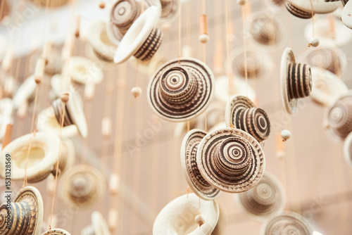 Decorative hanging ornaments with ceramic traditional Colombian hats, handicraft of Raquira, Colombia, a town known for its pottery.