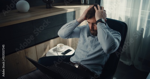 Stressed Financial Analyst Monitoring Exchange Market Charts and Real-Time Stocks Falling on Laptop, Soaking Financial Loss. Investment Agent Depressed About Bad Economy News, Stock Market Crash.