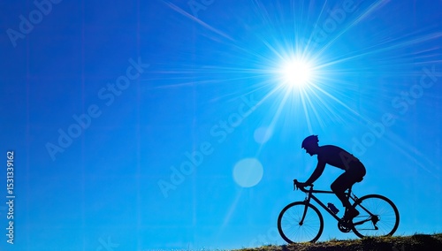 Silhouette of cyclist on a sunny day