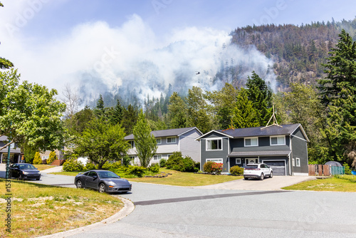 Neighborhood with Active Forest Fire in Squamish, BC, Canada and Smoke Rising