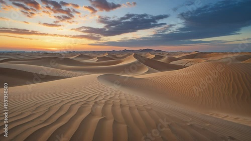 Discover the Stunning Landscape of Golden Sand Dunes and Dynamic Patterns at Sunset in the Desert