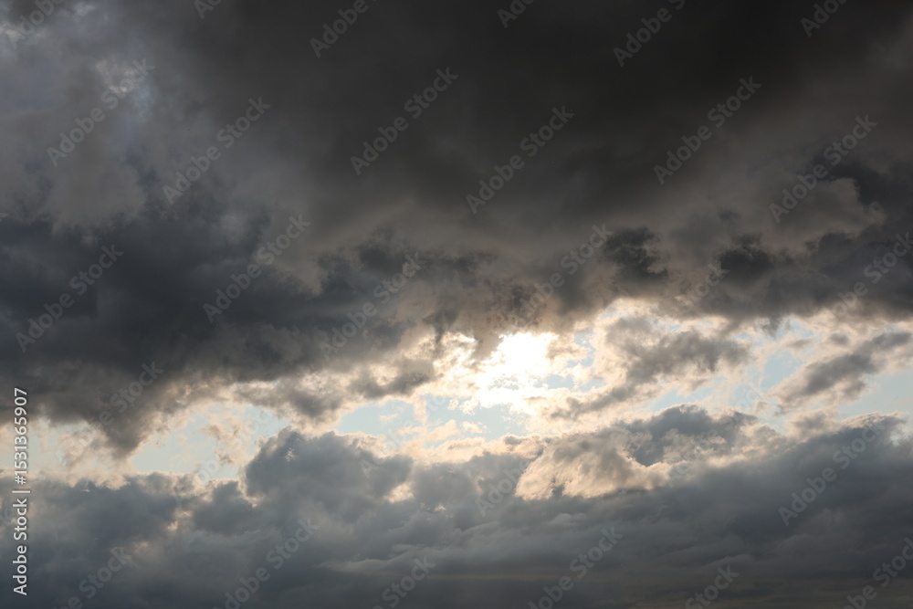 Obraz premium dramatic sky with clouds and sun