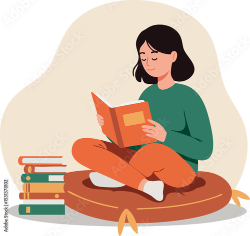 Girl reading book sitting cross legged on cushion with stack of books nearby 