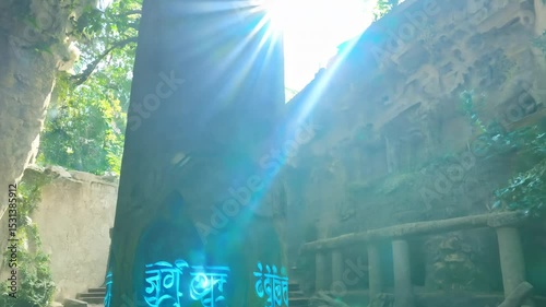 A column with strange glowing ancient writings in the middle of an abandoned temple in mossy forest. A soft glow emanates from the writings on the column, drawing adventurers into the unknown.