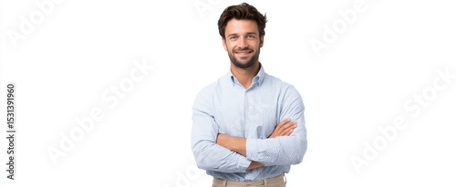 The confident young man standing proudly with arms crossed in a professional style.