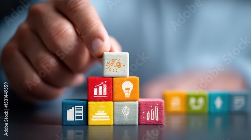 Colorful wooden blocks with icons representing growth and development.