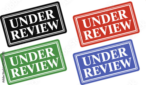 A close up of a white paper with the words under review in red letters