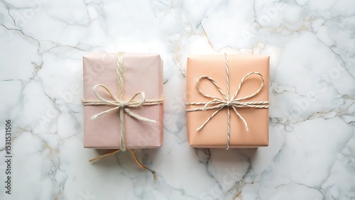 Gift Boxes with Rustic Bows: Two neatly wrapped gift boxes, adorned with simple rustic bows, are presented on a textured surface, evoking a sense of homespun charm and anticipation.