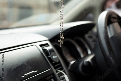 Cross in the car mirror