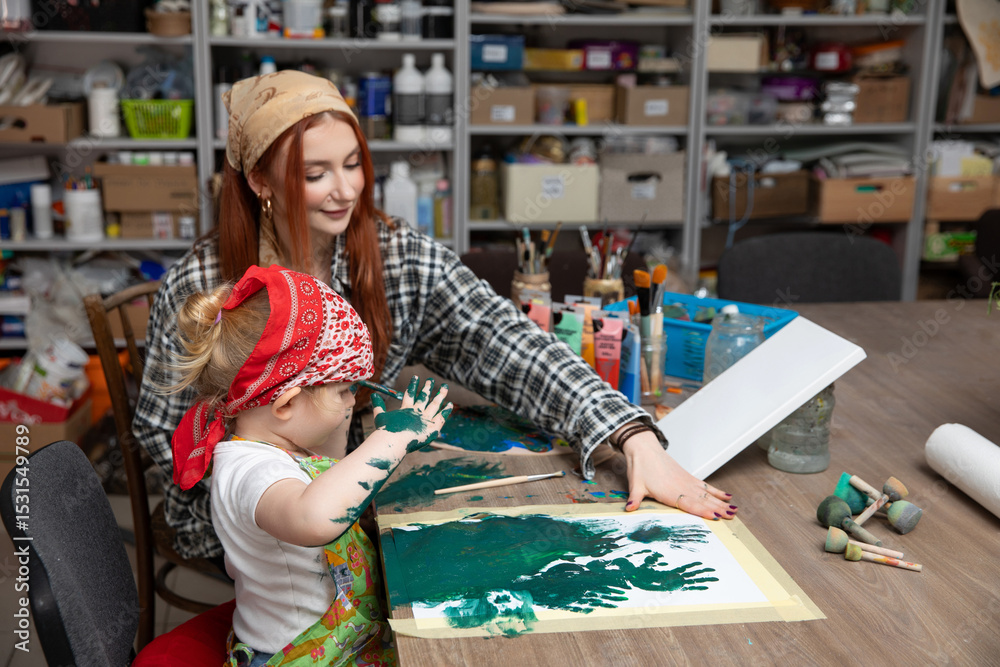 Fototapeta premium A Creative Moment A Child and an Adult Actively Engaging in Art Together, Nurturing Creativity
