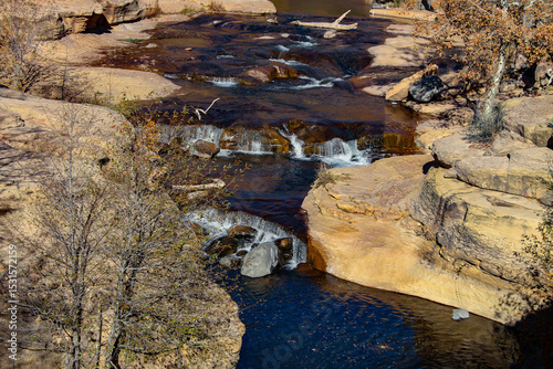 Photo of stream flowing through a rocky canyon in the desert area of the American Southwest
