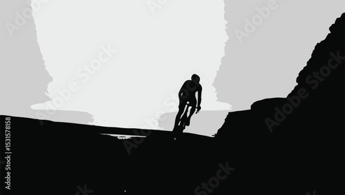 Silhouette of a cyclist climbing a mountain road against a grayscale sky background