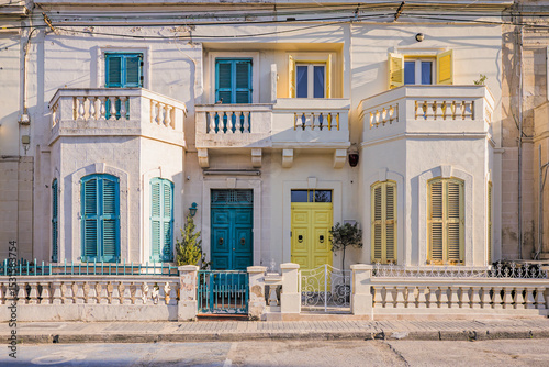 Beautiful view of a typical Maltese house with colorful doors and window shutters in Saint Julian's (San Ġiljan), Malta