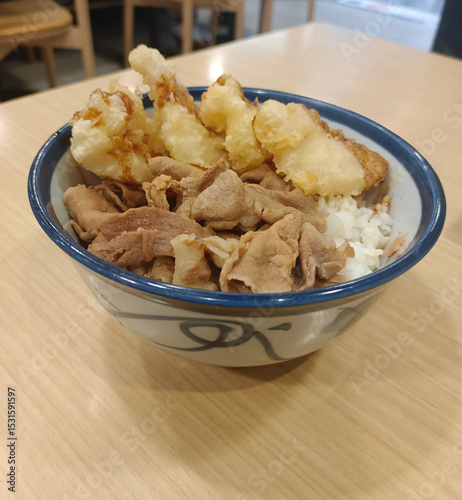 top view Pork stir-fried in Korean sauce, served over rice in a bowl on a wooden table, food, hot, delicious, valuable, copy space