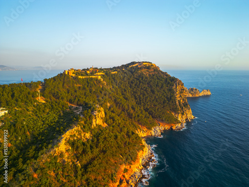 Red Fortress of Alanya at sunset drone view.