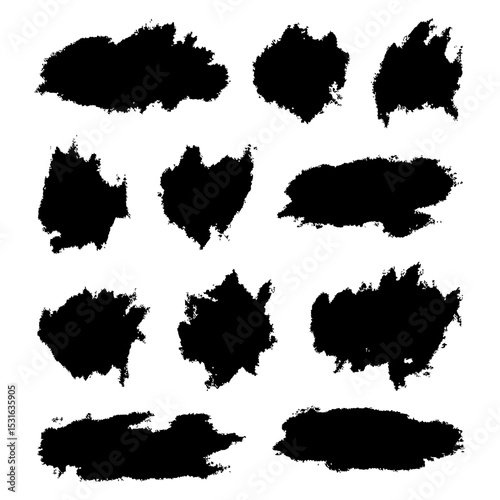 Collection of black hand-drawn brush strokes and ink stains