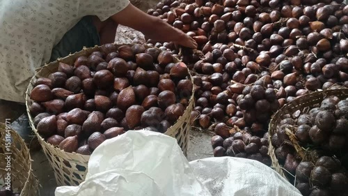 A bountiful harvest of salak, also known as snake fruit. Baskets overflowing with this tropical delicacy showcase its unique textured skin and fresh appeal.