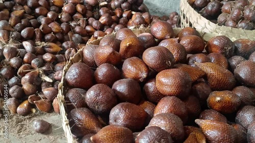 An abundance of salak in woven baskets, a palm fruit from Indonesia. Freshly harvested, sweet, and nutritious, ready for the marketplace.