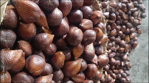 A pile of 'Salak' (snake fruit) shows its scaly skin and unique texture. This tropical treasure is delicious, healthy, and ready to delight. 