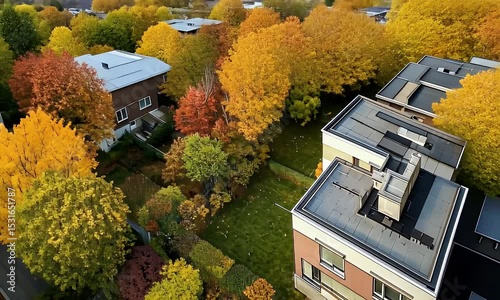 Aerial View of Residential Buildings with Colorful Autumn Foliage and Green Lawns