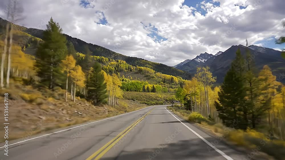 Driving Through Aspen Autumn Leaves Scenic Road with Mountain Backdrop Driving Through Aspen Autumn Leaves Scenic Road with Mountain Backdrop