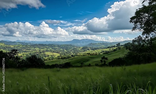 Rolling Green Hills Under Blue Skies And White Clouds in Daylight Nature Photography