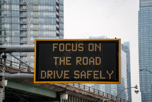 View of ''Focus on the Road, Drive Safely'' Road Sign.