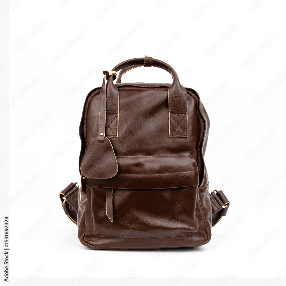 Fototapeta premium Coffee brown leather backpack isolated on white background, perfect for leather products catalog design
