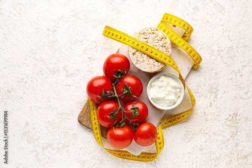Board with tomatoes, rice c...