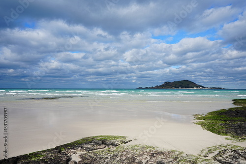 fascinating seascape with clear sand beach and charming clouds