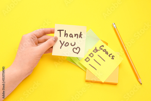 Woman with sticky notes and...