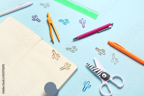 Wallpaper Mural Notebook with different stationery supplies on blue background Torontodigital.ca