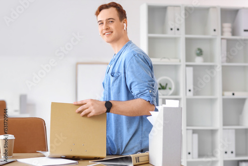Young businessman with fold...