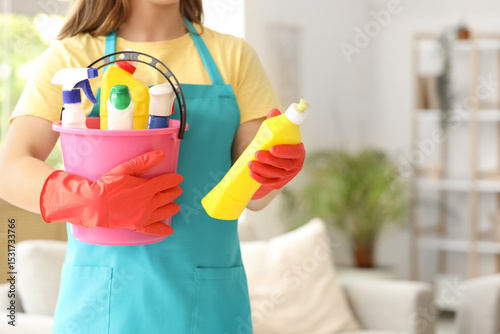 Female janitor with bucket ...