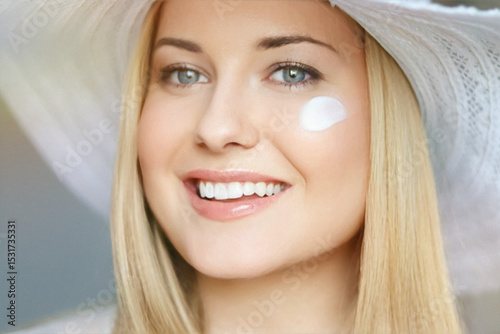 Beauty, suntan spf and skincare cosmetics model face portrait, woman in summer beach hat with moisturising cream, sunscreen product or sun tan lotion on her cheek, luxury facial and skin care ad