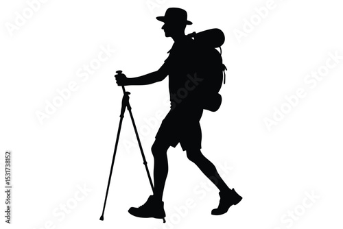 Silhouette of a man hiking with a backpack and trekking poles