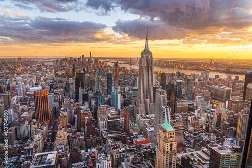 Manhattan from above the ground during the sunset. View of the building skyline and Hudson River. New York City, NYS, United States of America. Real photography.