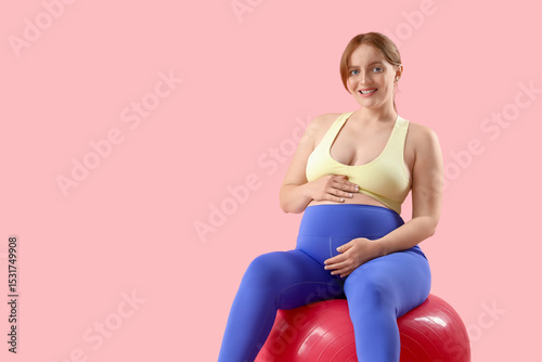 Sporty young pregnant woman...