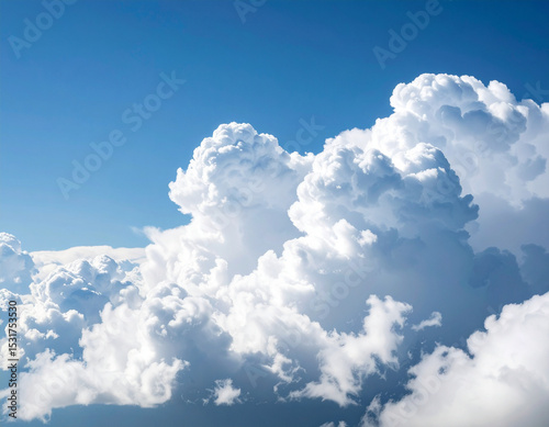 Towering cumulus clouds in blue sky