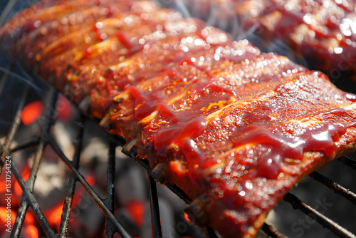 Barbecue Ribs Sizzling on Grill: Close-up shot of a rack of succulent, tender barbecue ribs glistening under the heat on a rustic grill, their savory aroma wafting through the air.