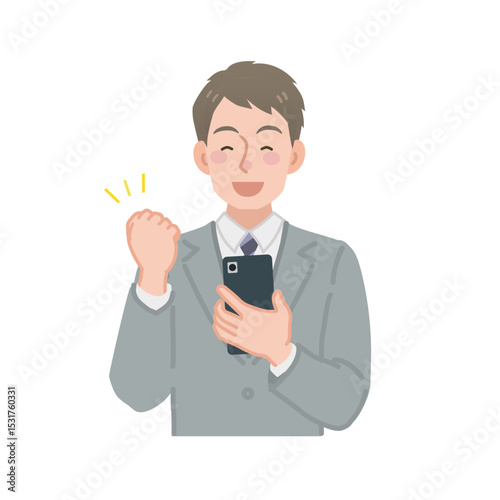 スマホを見てガッツポーズをするビジネスマン