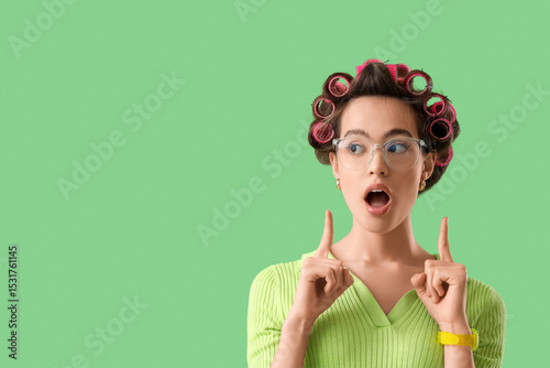 Shocked young woman pointin...